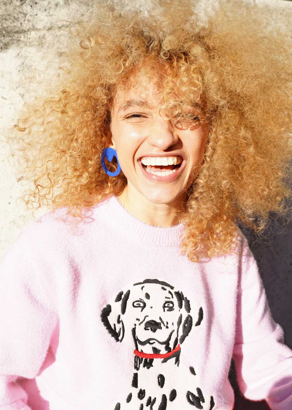 Nalu Rodrigues in a white Outsiders Division look for The Friendship editorial, photographed by Lorena Varela.